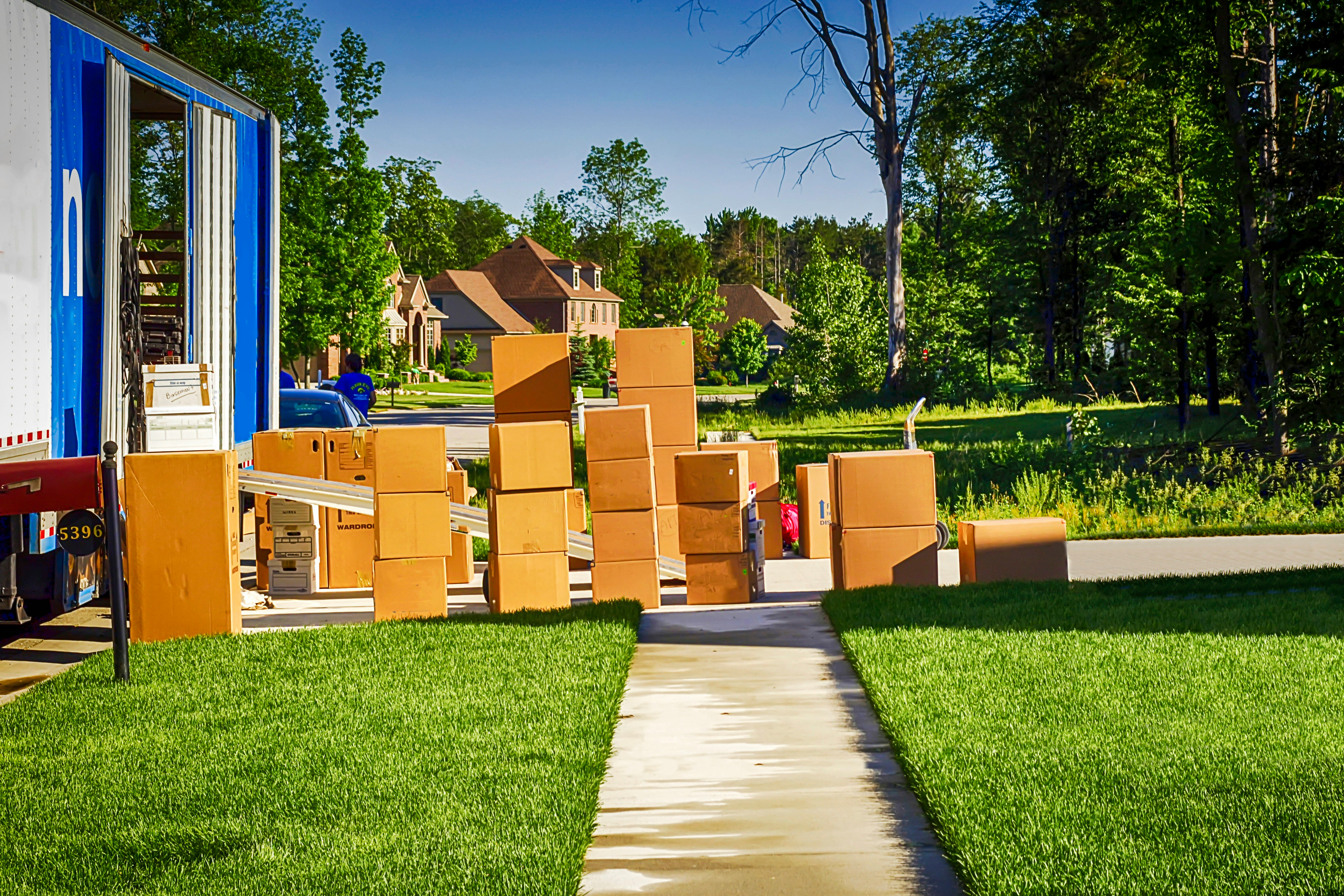 Residential moving boxes on a sidewalk